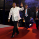 U.S. President Barack Obama, wearing the traditional Philippine "barong" shirt, waves as he arrives for a welcome dinner during the Asia-Pacific Economic Cooperation (APEC) summit in the capital city of Manila, Philippines November 18, 2015.